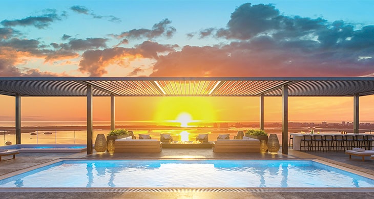 Garcia Stromberg firm designs Island West Bay rooftop pool at sunset