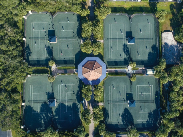 aerial of the tennis courts at west bay club