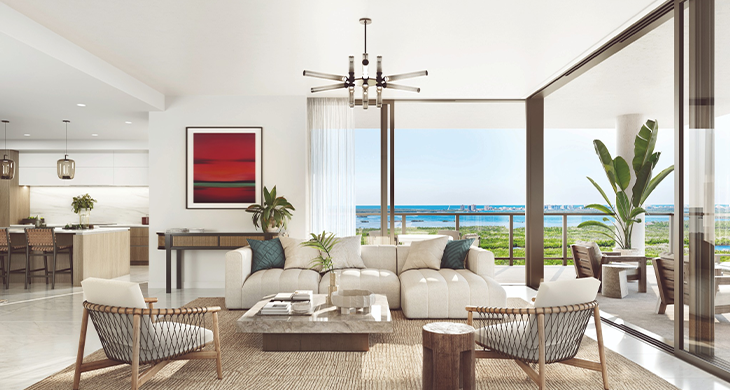 Modern living room with balcony overlooking water.