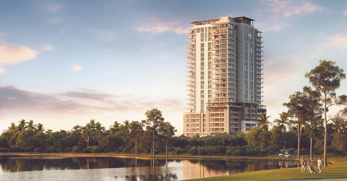 Tall residential tower overlooking golf course and water features.
