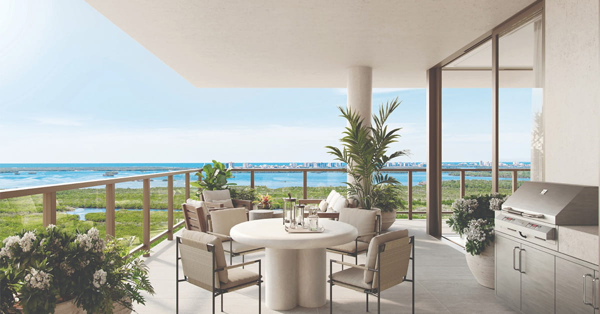 Luxury outdoor terrace with dining space and panoramic waterfront views.