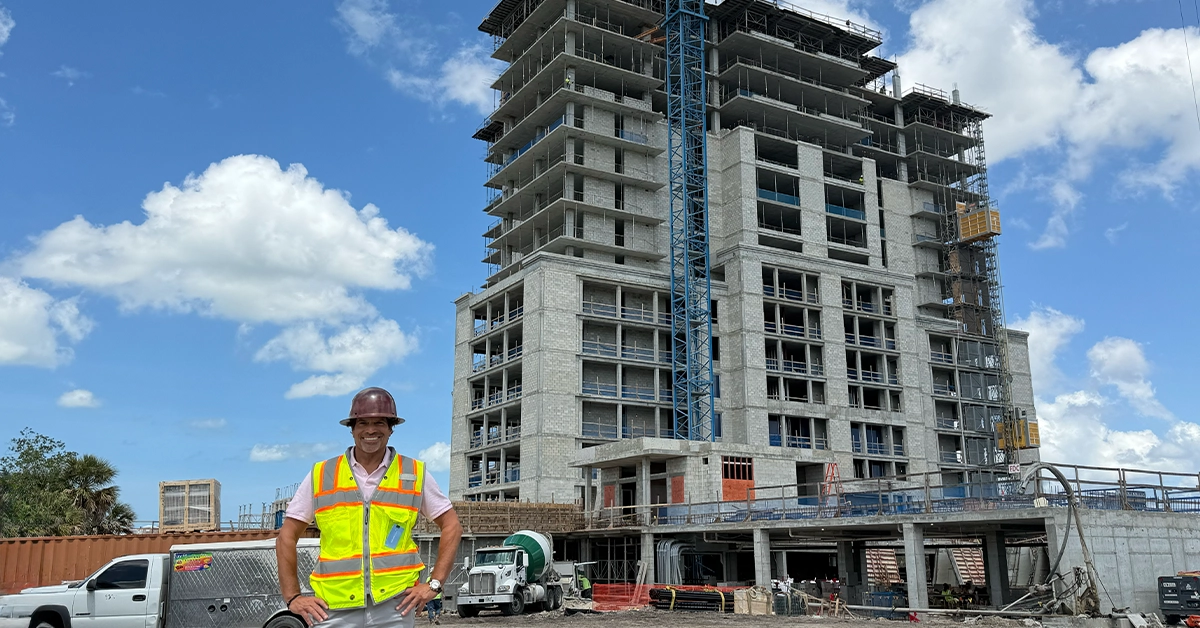 Joe in front of the Island at West Bay construction.